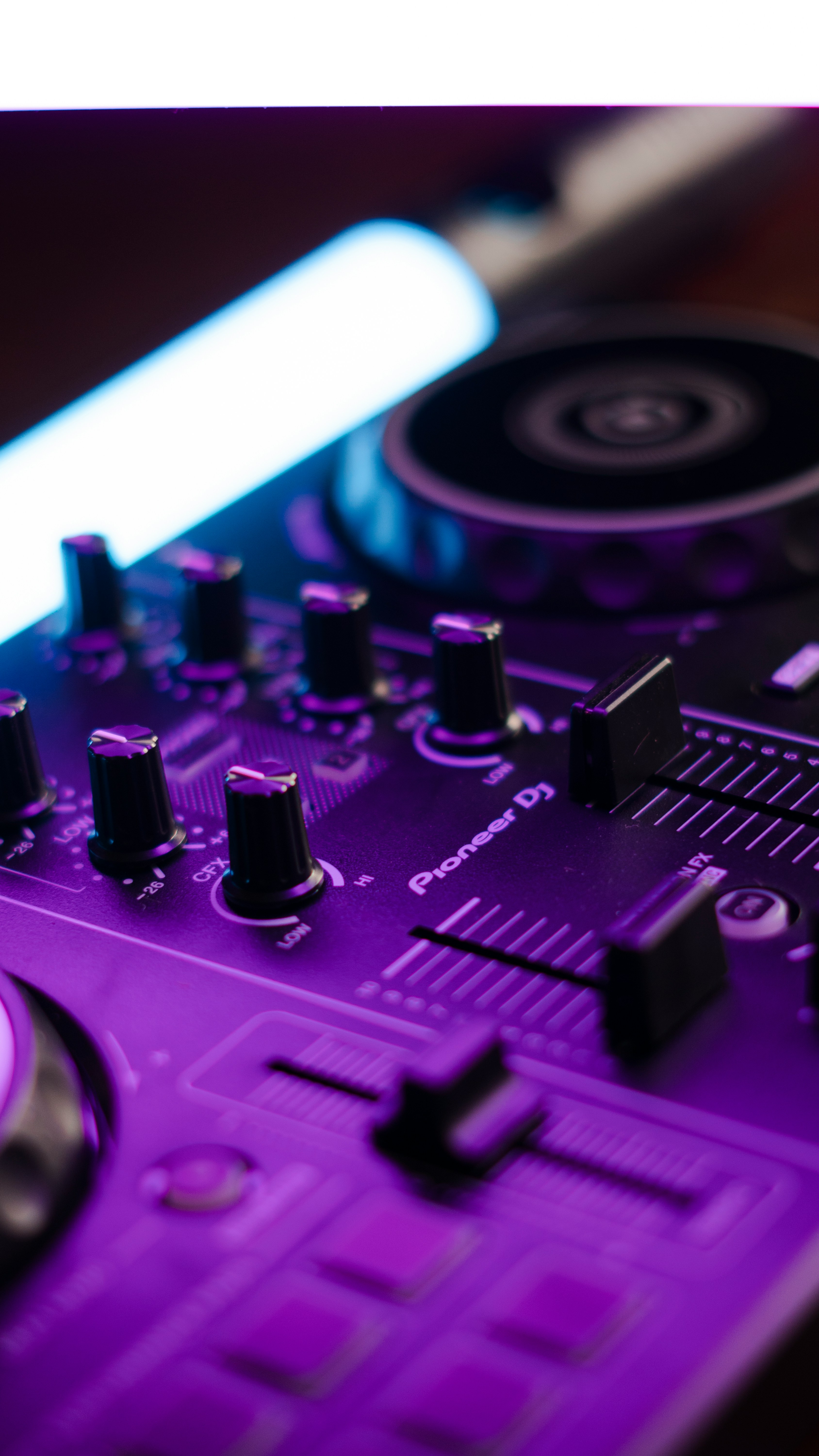Close-up of a Pioneer DJ controller with purple lighting