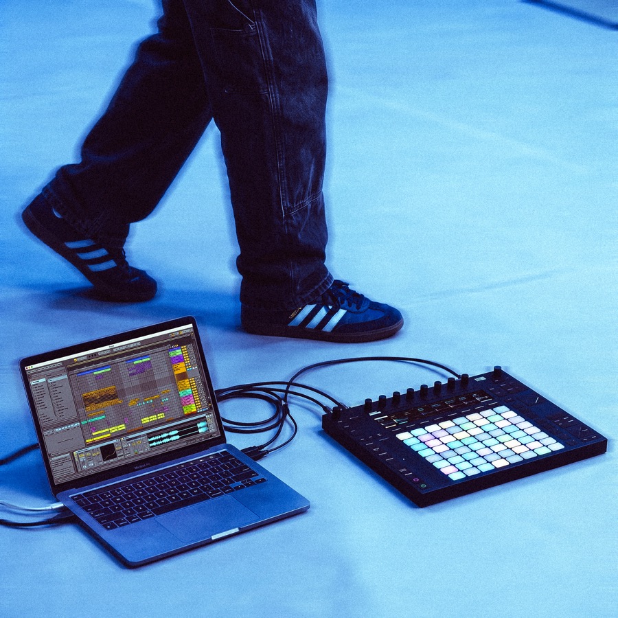 Student's laptop running Ableton Live beside an Ableton Push controller