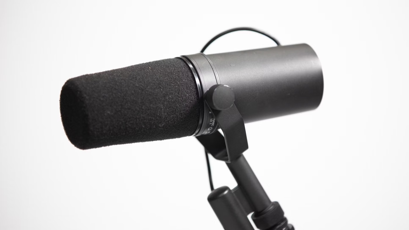 A Shure SM7B studio microphone on a boom arm